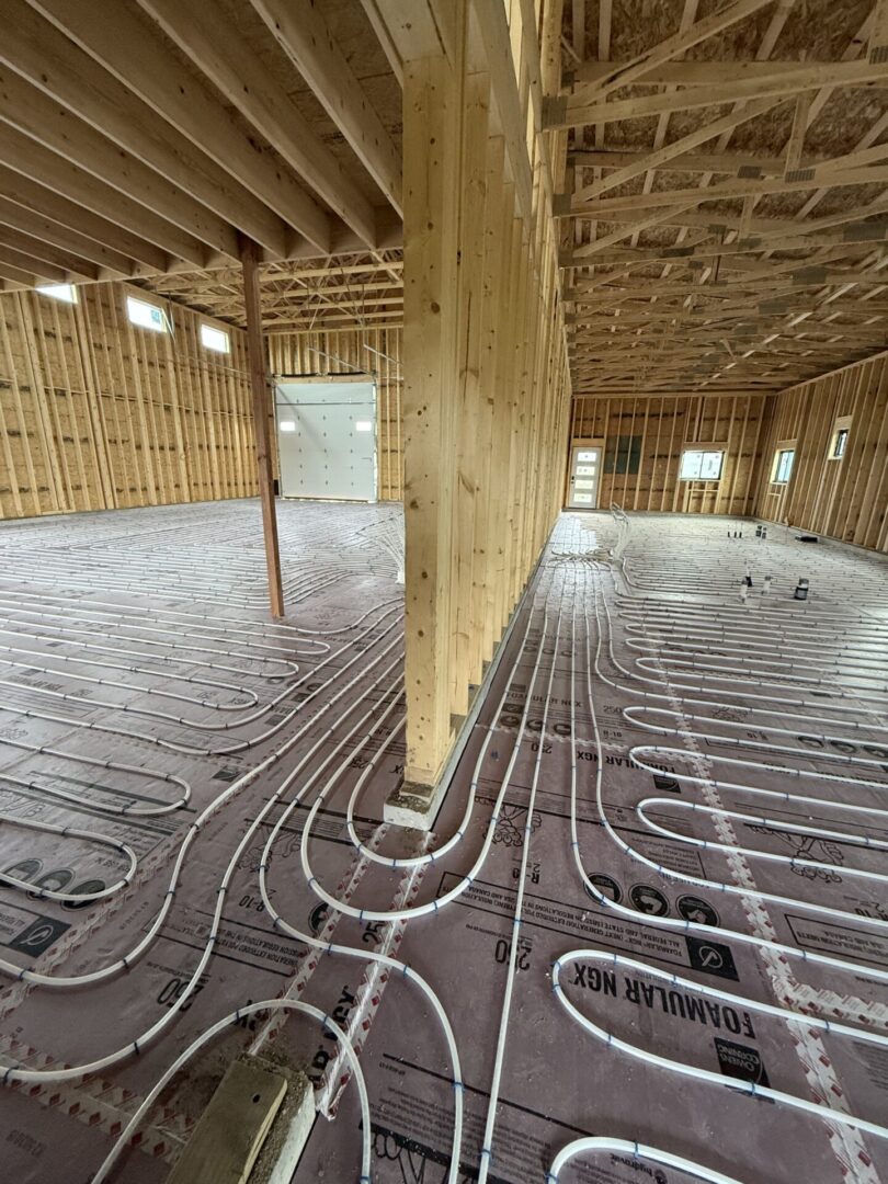 Radiant floor heating tubing in wooden building