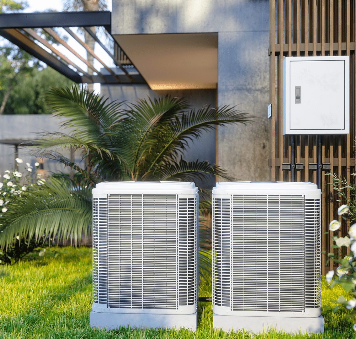 Twin air conditioning units in garden