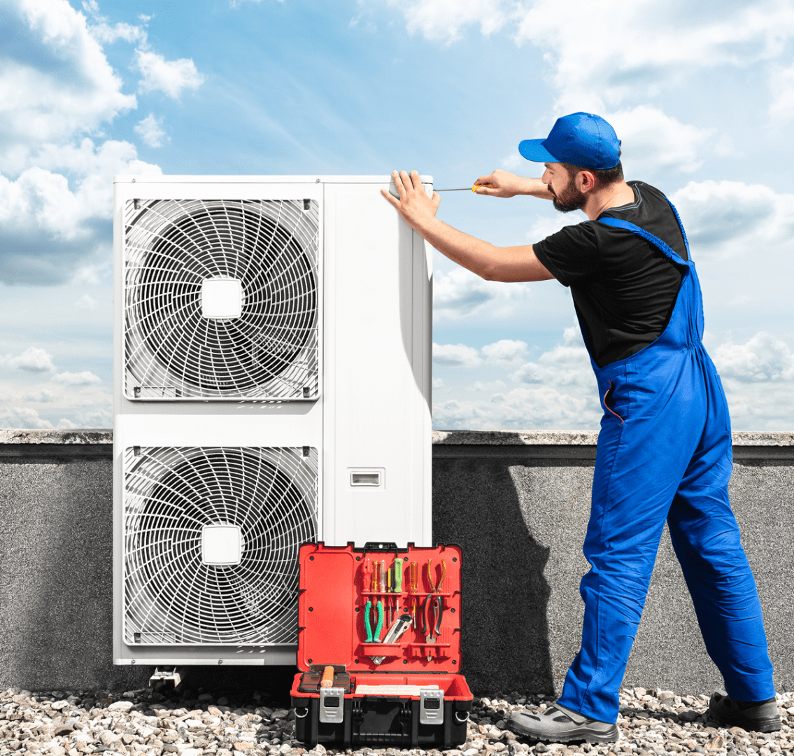 Technician repairing outdoor AC unit