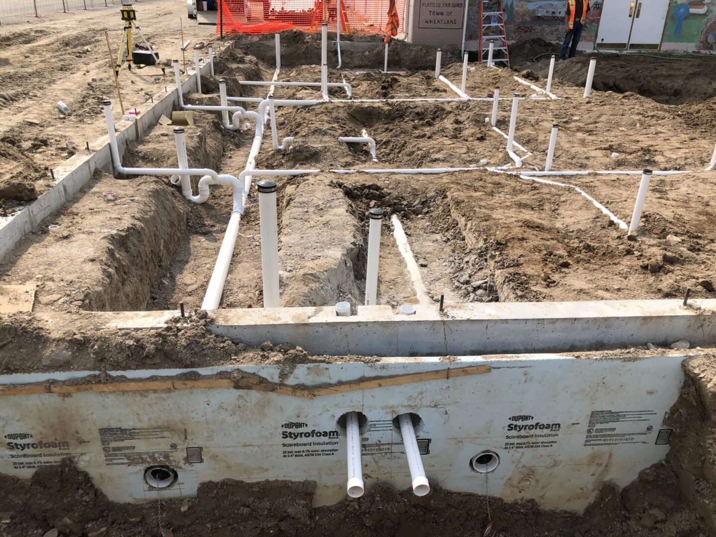 PVC plumbing layout in foundation trenches
