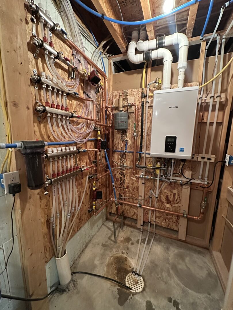 Basement hydronic manifold and tankless heater